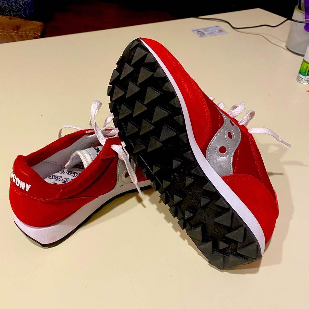 Red Saucony shoes, never worn.